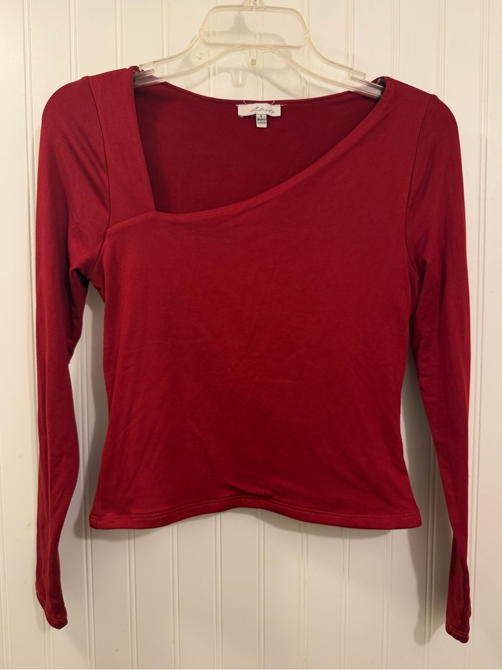 red asymmetrical long sleeve top